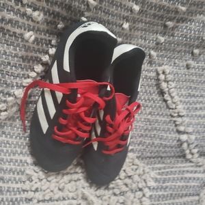 Black red and white cleats